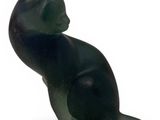 statue of a cat sitting on its hind legs on a white surface