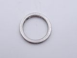 a silver ring on a white surface with a white background