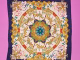 a close up of a square scarf with a clock on it