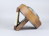a wooden object that is sitting on top of a table
