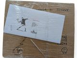 a piece of paper that has been wrapped up on top of a cardboard box