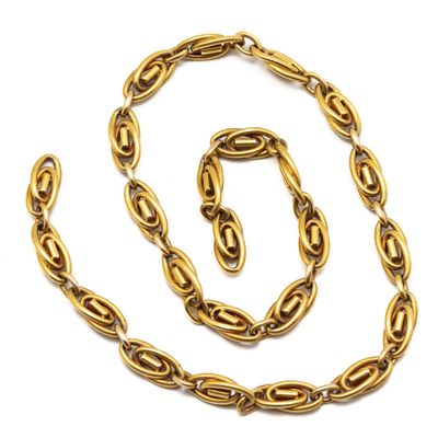a gold necklace and bracelet set on a white background