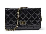a black quilted purse with a gold chain strap