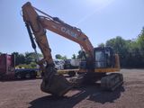 a large excavator that is sitting in the dirt