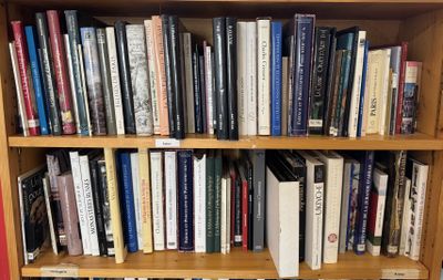 a book shelf with many books on it in a library