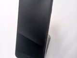a cell phone that is sitting on top of a stand