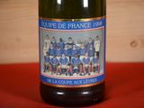 a bottle of wine with a picture of a soccer team on it