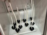 a small refrigerator with a bunch of wires in it