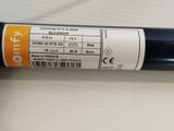 a close up of a black pipe on a table