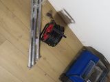a picture of a room with a hard wood floor and a fan on the floor