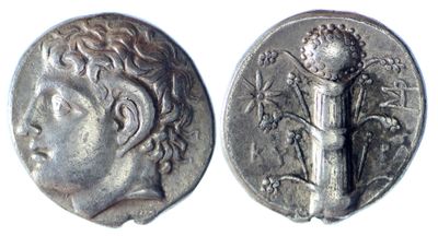 a close up of a silver coin with a woman on it