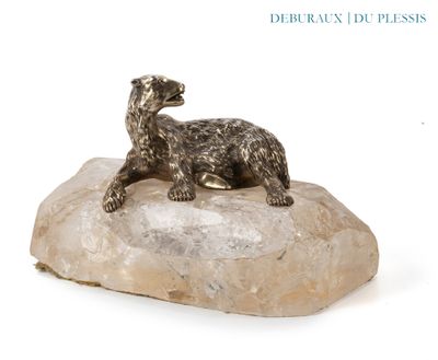 a statue of a dog sitting on top of a rock