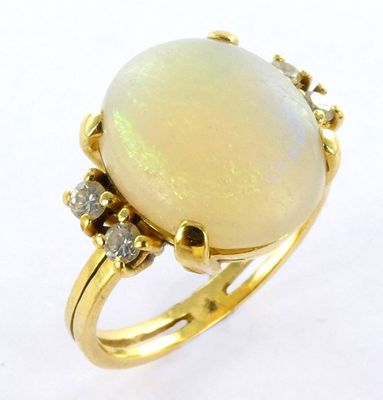 an oplite and diamond ring set in yellow gold