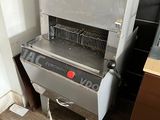 a machine that is sitting on the floor in the kitchen