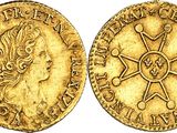 a gold coin with a woman ' s face and a star on it