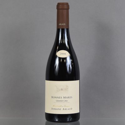 a bottle of wine that is sitting on a table