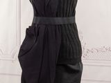 the dress is black and has a belt on it