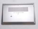 a silver laptop computer sitting on top of a white table