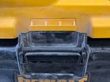 a close up of the back end of a yellow truck