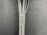 a close up of a spoon on a table with a fork in it