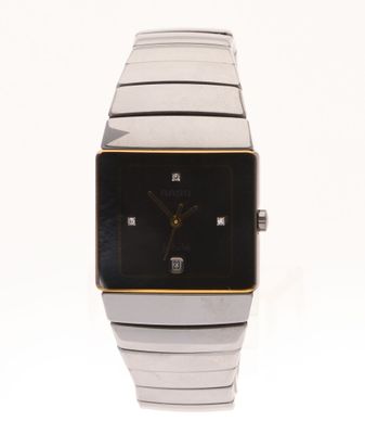 a close up of a watch on a white surface
