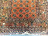 an old rug with a design on it is laying on the floor