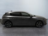 the grey car is parked on the concrete floor in the room