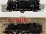 two model trains in a display case on a table