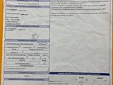 an image of a paper with a picture of a car ' s driver ' s license on it