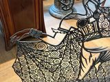 a metal sleigh sitting on the floor in a room