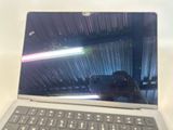 a laptop with a camera on the screen on a table