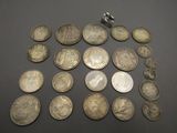 a lot of coins that are on the table