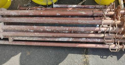 a pile of construction equipment that is sitting on the ground