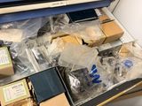 a drawer full of assorted items in a room