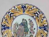 a plate with a picture of a man and a woman on it