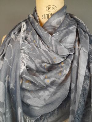 grey scarf with a floral design on it on a mannequin mannequin mannequin mannequin mannequin mannequin mannequin mann