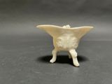 a small white object that is on a table