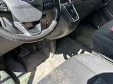 the interior of a truck with a steering wheel and dashboard