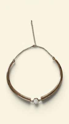 a close up of a bracelet on a white background