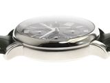 a close up of a watch on a white surface