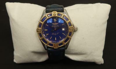 a watch that is sitting on a pillow on a table
