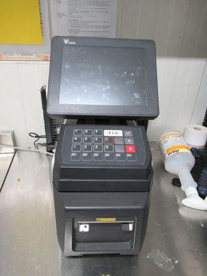 an image of a pos machine sitting on a counter