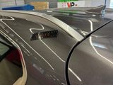 a close up of a car with a sticker on it