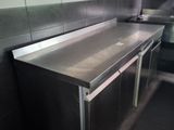 a stainless steel counter in a commercial kitchen