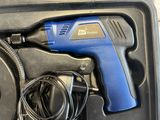 a blue and black cordless drill in a black box