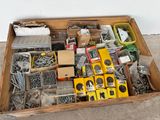 a box full of assorted tools sitting on the floor