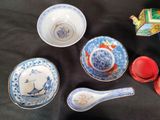 many different types of bowls and spoons on the table