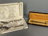 a silverware set in a case with a spoon and fork