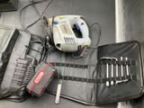 a tool bag with tools in it on a table