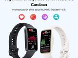 a couple of smart watches with different colors on them